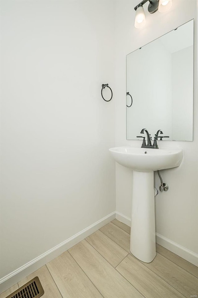 bathroom featuring hardwood / wood-style flooring