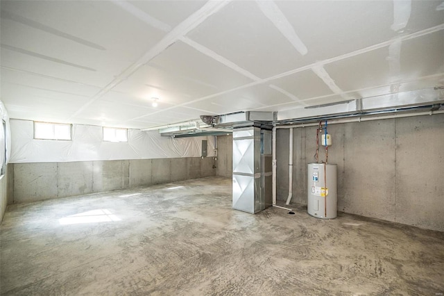 basement featuring heating unit and water heater