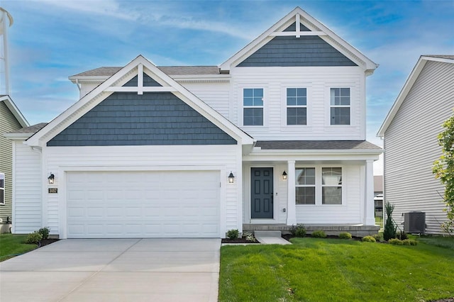 craftsman house featuring a front lawn, a garage, and central AC unit