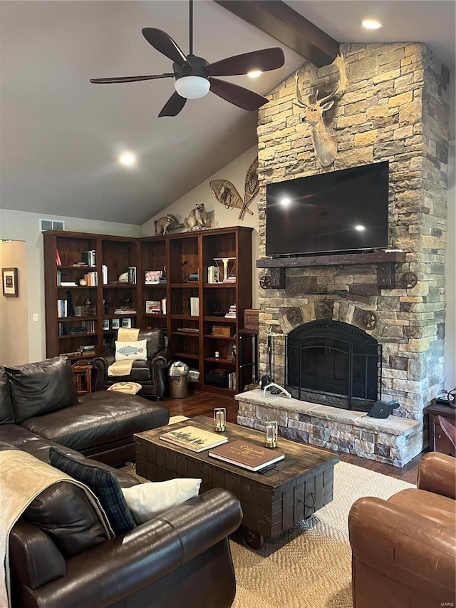 living room featuring lofted ceiling with beams, ceiling fan, hardwood / wood-style floors, and a fireplace