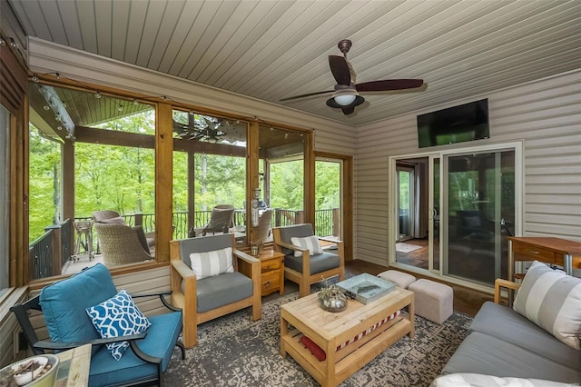 sunroom / solarium featuring wood ceiling and ceiling fan