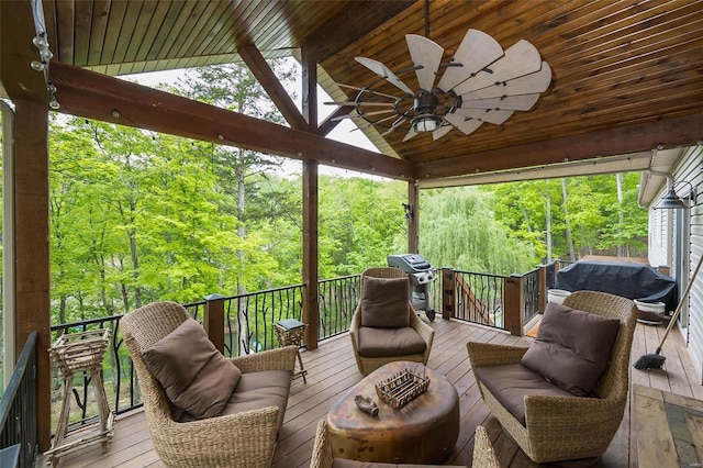 sunroom with wood ceiling, ceiling fan, and vaulted ceiling