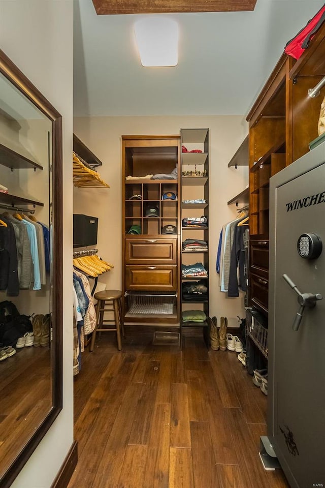 spacious closet with dark hardwood / wood-style floors