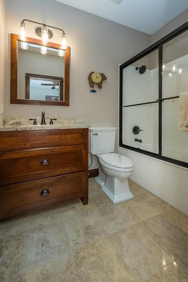 full bathroom with shower / bath combination with glass door, vanity, tile floors, and toilet