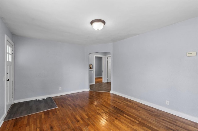 empty room with hardwood / wood-style floors