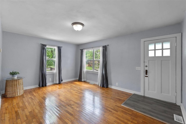 entryway with light hardwood / wood-style flooring