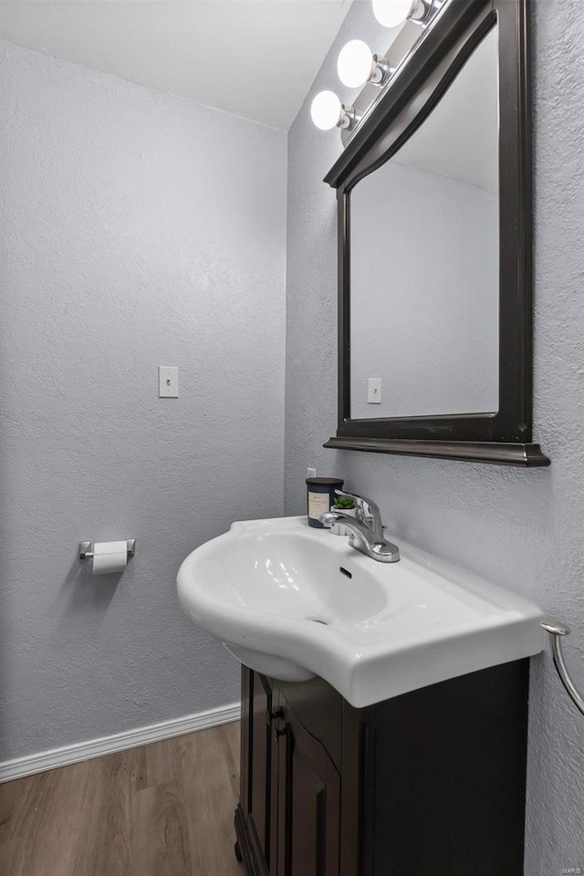 bathroom with wood-type flooring and vanity