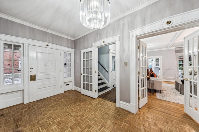 entrance foyer with parquet flooring, french doors, and a chandelier