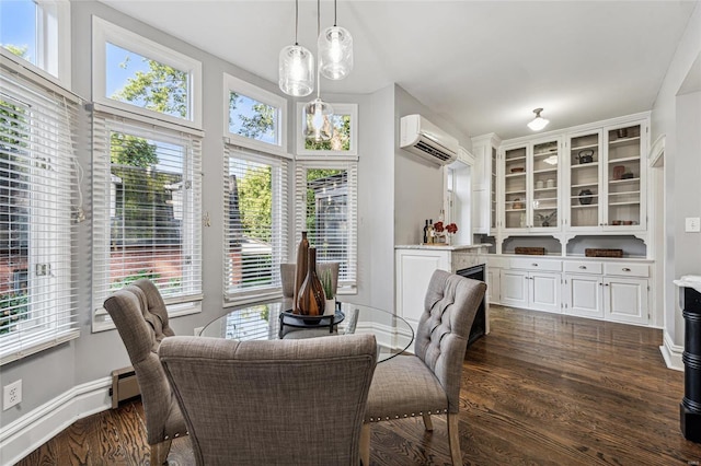 dining space with a healthy amount of sunlight, dark hardwood / wood-style floors, a baseboard radiator, and a wall mounted air conditioner