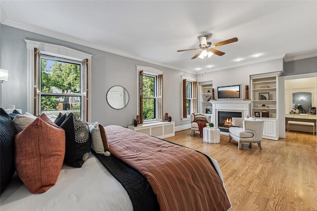 bedroom with ceiling fan, light hardwood / wood-style flooring, and ornamental molding