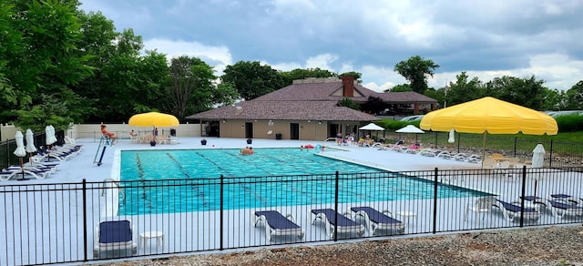 view of swimming pool with a patio