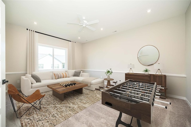 carpeted living room featuring ceiling fan