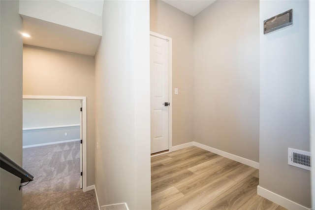 corridor featuring light hardwood / wood-style floors