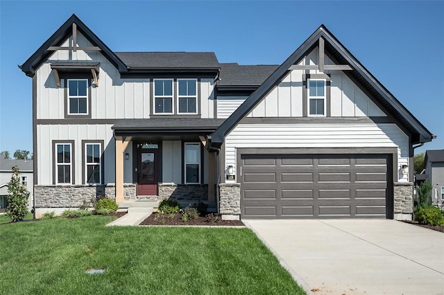 view of front of home with a garage and a front yard