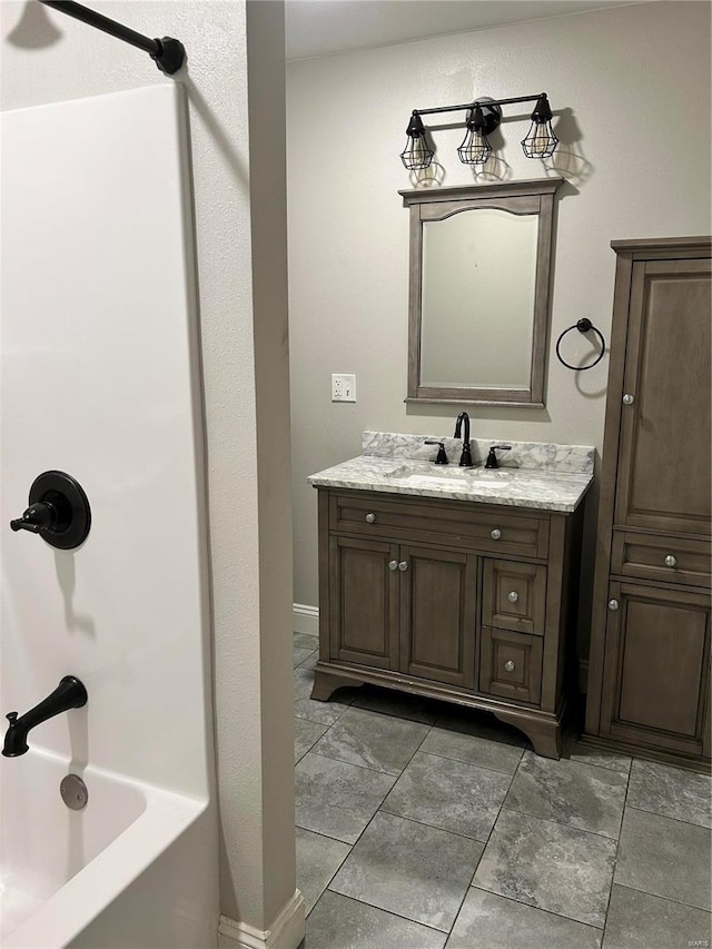 bathroom with vanity and shower / tub combination