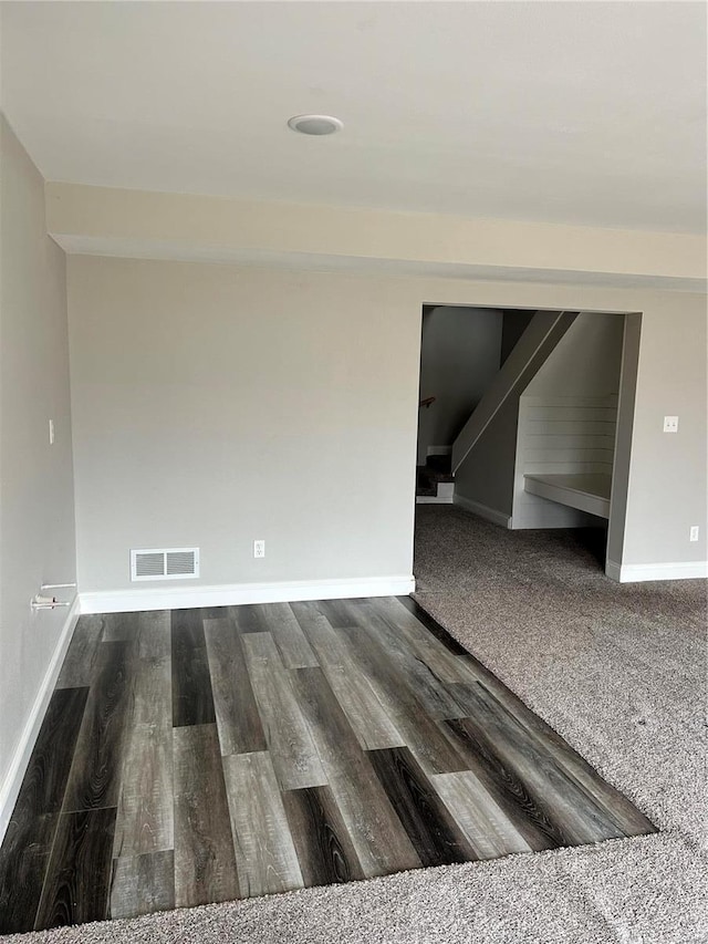 unfurnished room featuring wood-type flooring