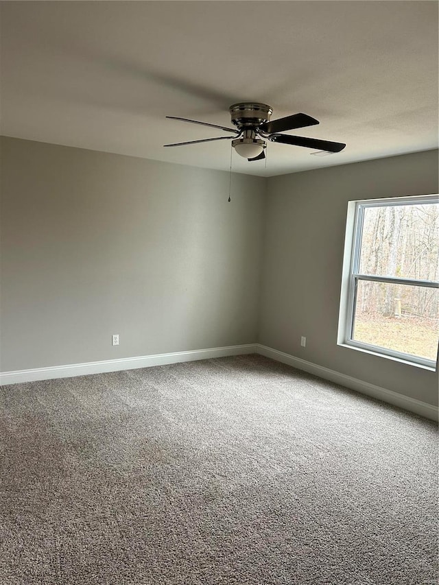 carpeted empty room with ceiling fan