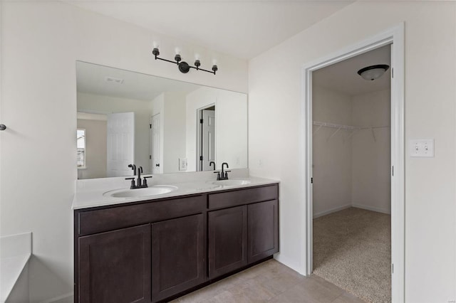 bathroom featuring tile floors and dual bowl vanity