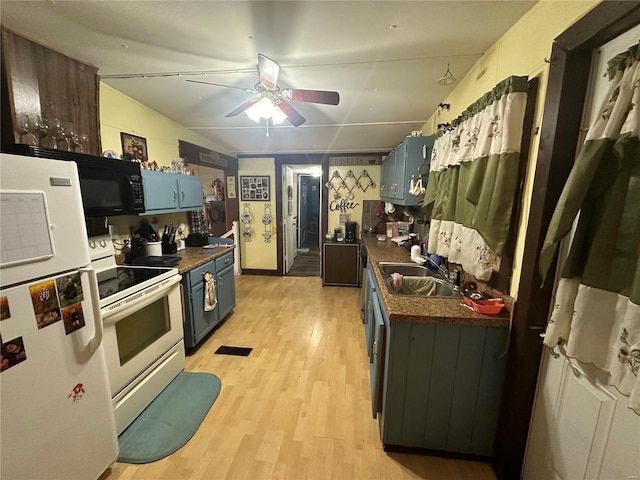 kitchen featuring sink, ceiling fan, white appliances, and light wood-type flooring