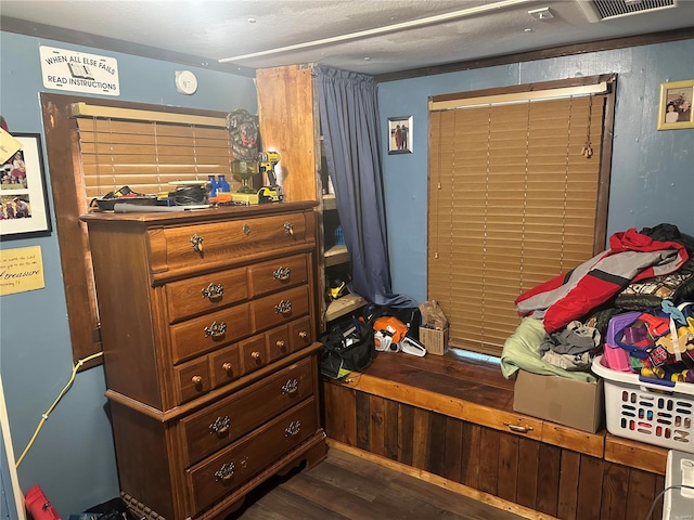 bedroom with dark wood-type flooring