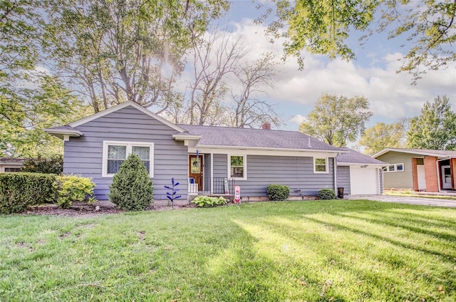 exterior space with a front lawn and a garage