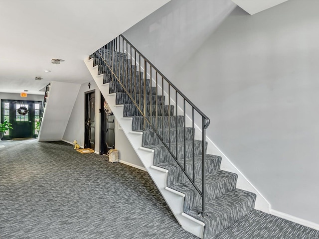 stairs featuring carpet floors