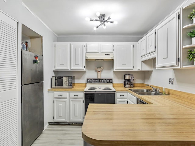 kitchen with white cabinetry, light wood-type flooring, appliances with stainless steel finishes, sink, and ornamental molding