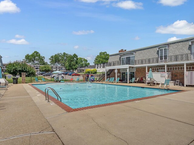 view of swimming pool with a patio area