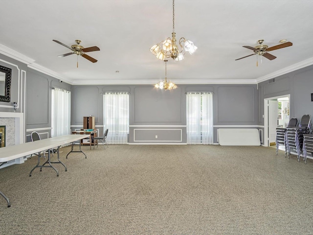 misc room featuring ceiling fan with notable chandelier, crown molding, and plenty of natural light