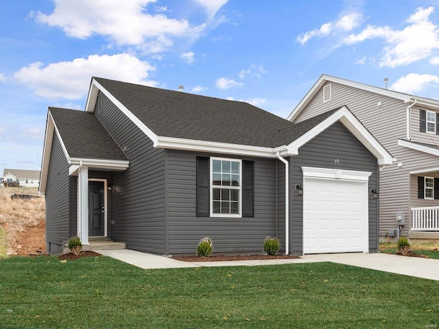 view of front of house with a garage and a front lawn