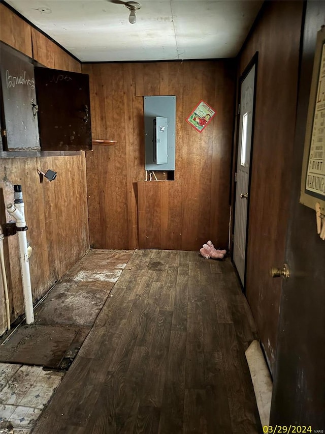 interior space featuring wood-type flooring and wood walls