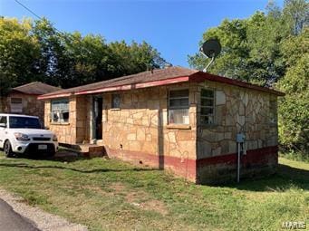 view of property exterior with a yard