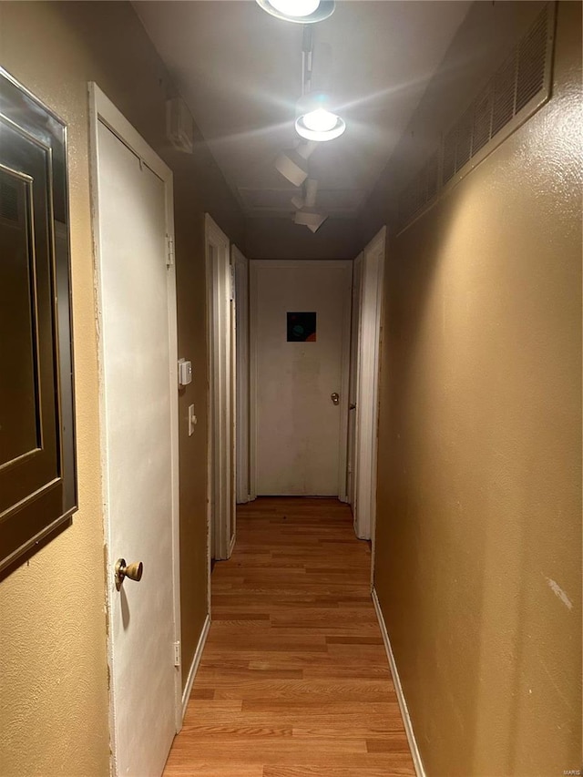 hallway featuring light hardwood / wood-style flooring