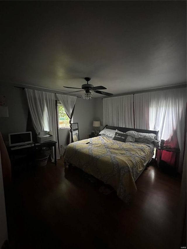 bedroom with wood-type flooring and ceiling fan