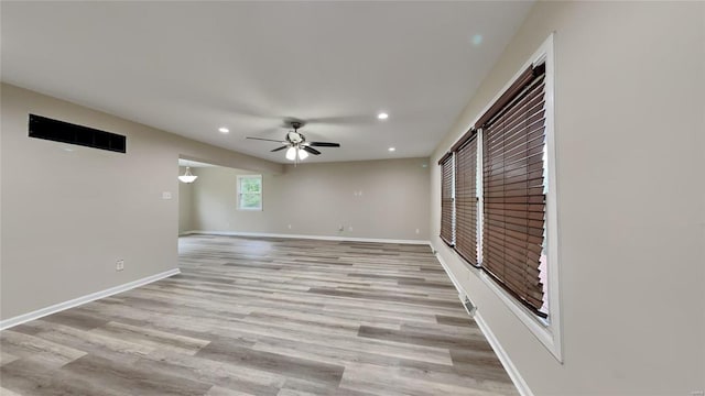 interior space with ceiling fan and light hardwood / wood-style flooring