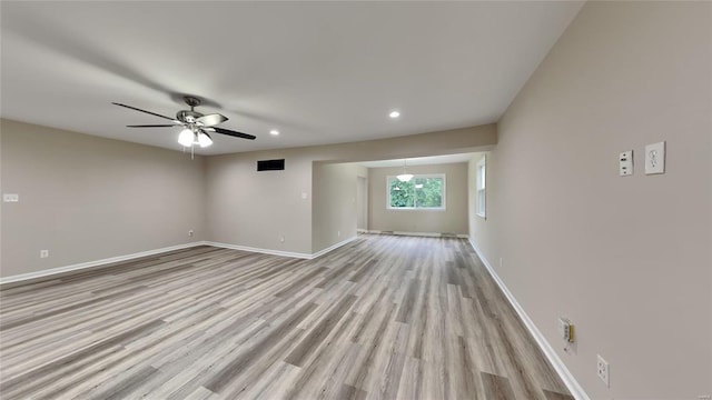 unfurnished living room featuring light hardwood / wood-style floors and ceiling fan