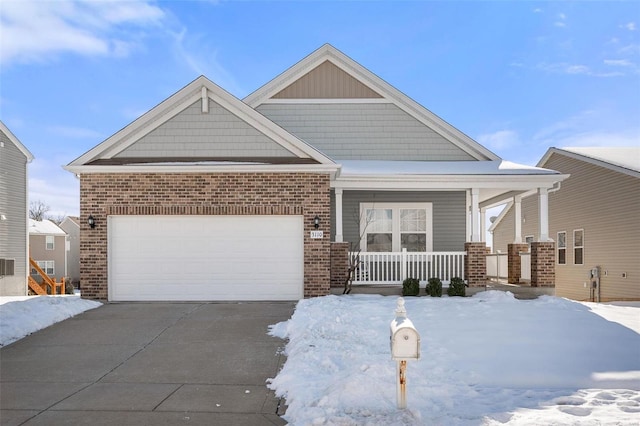 craftsman-style house with a garage and covered porch