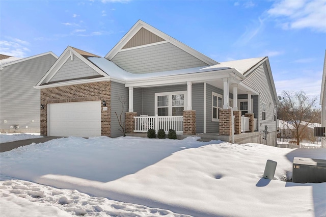 craftsman inspired home with a garage and a porch