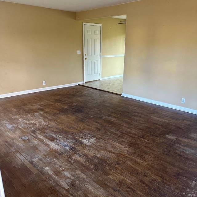 spare room featuring dark hardwood / wood-style flooring