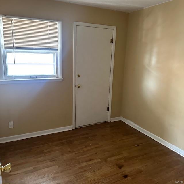 interior space with dark hardwood / wood-style floors