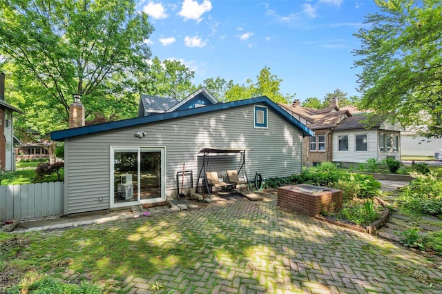 back of property with a patio area