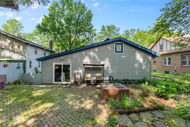 back of property with a patio area