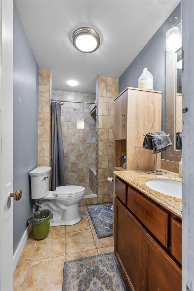 bathroom with a shower with curtain, vanity, toilet, and tile floors