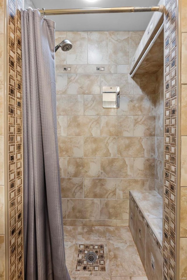 bathroom featuring curtained shower