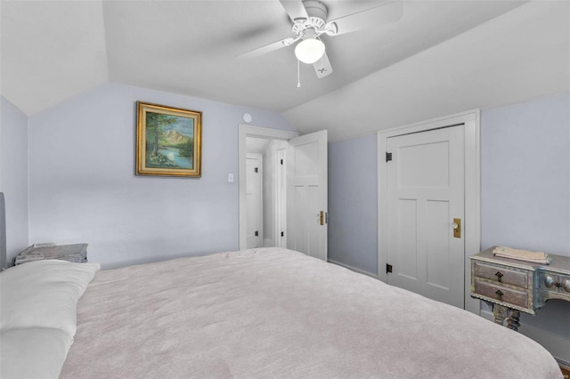 bedroom with ceiling fan and vaulted ceiling