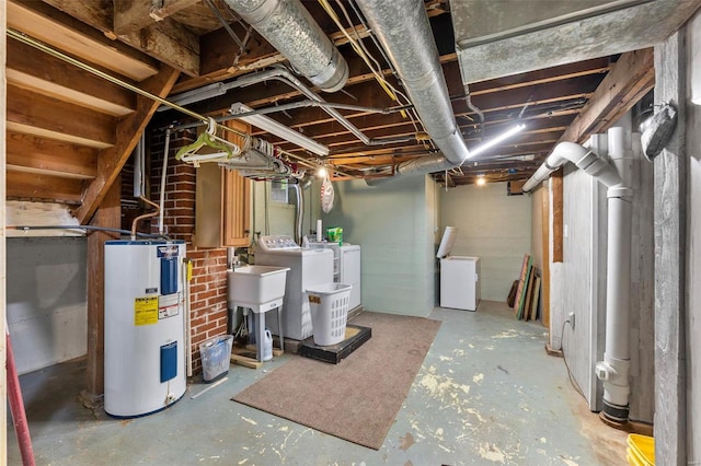 basement with washer and clothes dryer, water heater, and brick wall