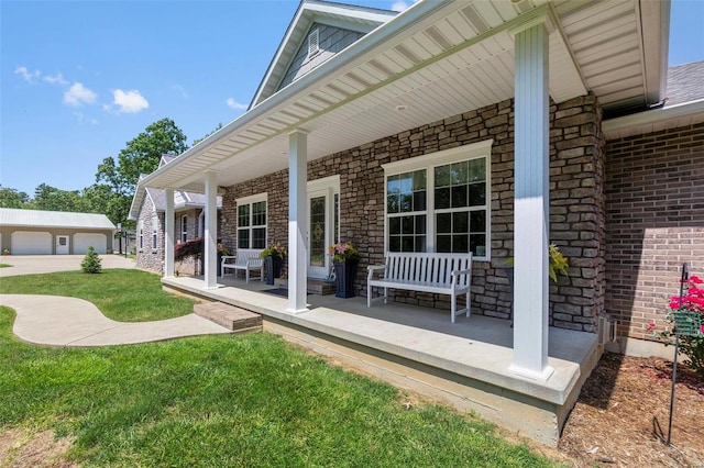 back of house featuring a yard and covered porch