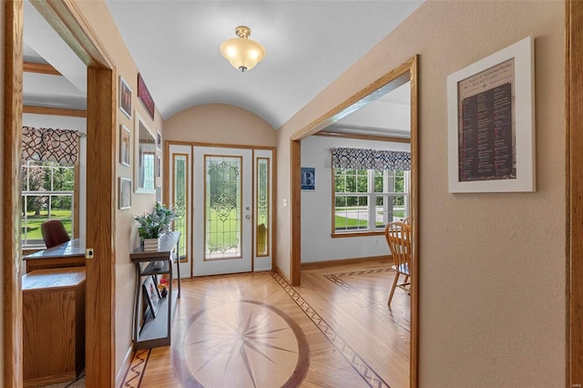 entrance foyer featuring light hardwood / wood-style floors and a wealth of natural light