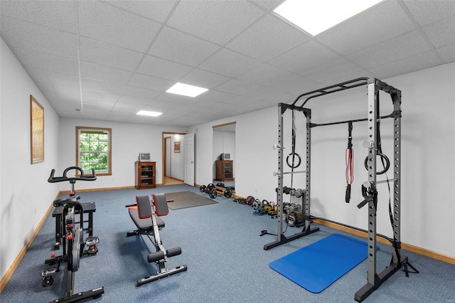 exercise area with a paneled ceiling