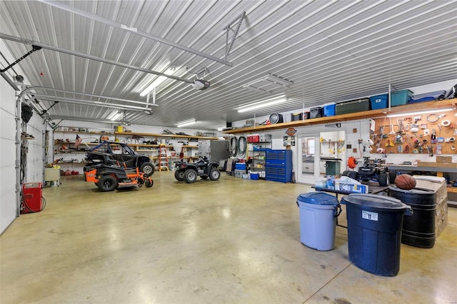 garage featuring a workshop area and a garage door opener